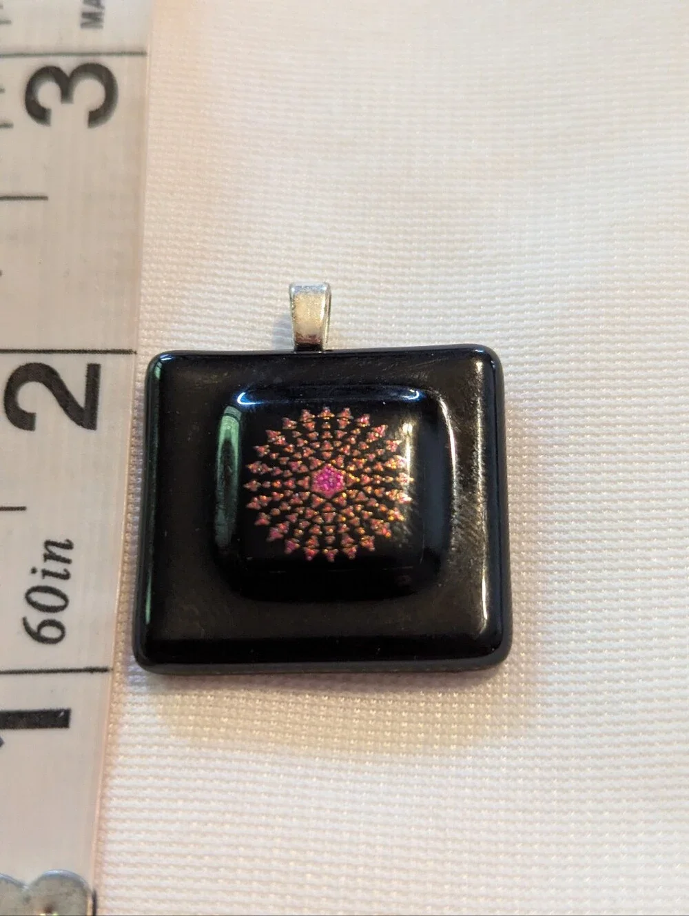 Black Pendant Featuring A Geometric Firework Pattern With Pink Center Handmade